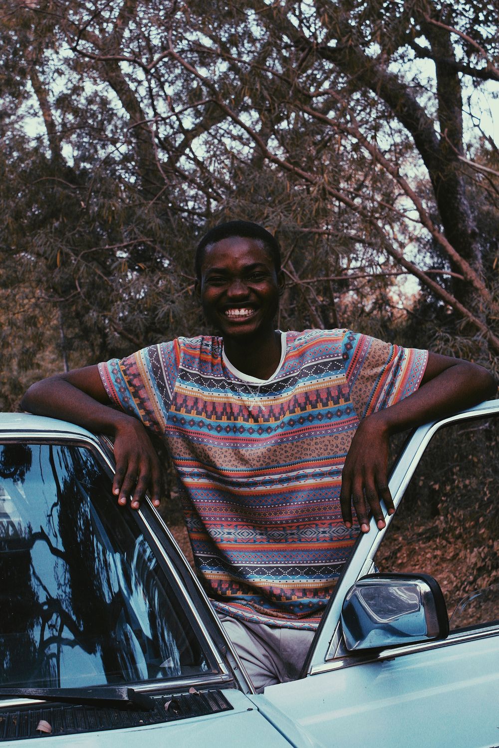 Illustrative photo of a person beside a vehicle